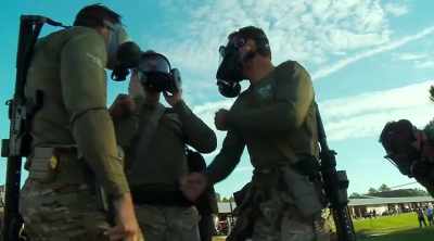 Swat officer:  Obviously,
   we don't have it
   as bad over here - Do Not Resist