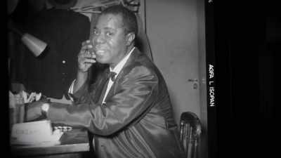 Sweat popping, eyes bugging,
mouth wide open, grinning, - Louis Armstrong's Black & Blues