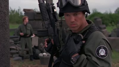 Taking fire! Wells has been hit. - Stargate SG-1