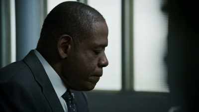 Talking to her,
holding her. - Godfather of Harlem