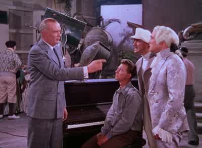 That means I'm out of a jobI can start suffering and write that symphonyWe'll put you in as head of the music departmentThanks I can stop suffering and write that symphony - Singin' in the Rain