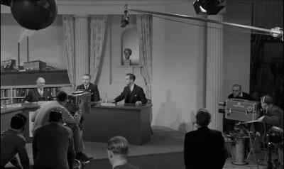 (Tannoy) 'On the air in five seconds. - I'm All Right Jack