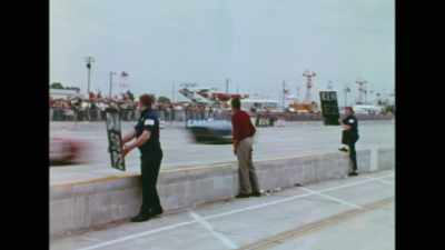 Team manager Carroll Shelby
keeps a paternal eye on the situation, - Shelby American