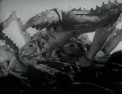 That fire won't hold it very long - Attack of the Crab Monsters
