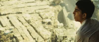 That used to be our slumCan you believe that huhWe used to live right there manNow it's all businessIndia is at the center of the world hub bhaiAnd II am at the centerof the centerThis is all Javed bhai'sJaved Khan SorryThe gangster from our slum You work - Slumdog Millionaire
