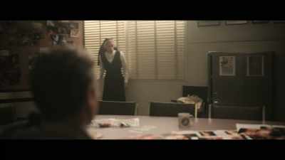 The arm, another clue, a lily. - Grotesquerie
