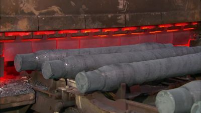 THE AXLES THEN GO THROUGH
A HEAT-TREATING PROCESS. - How It's Made