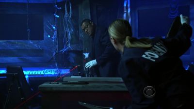 The background in the photo - CSI: Crime Scene Investigation
