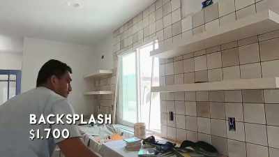 The backsplash in the kitchen
is being installed - Help! I Wrecked My House