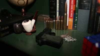The book case had bullets - Killer Cases