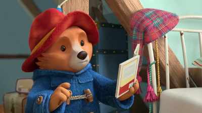 The book says, - The Adventures of Paddington