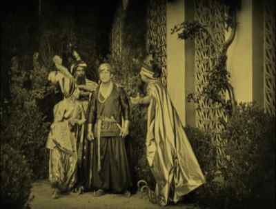 The Caliph awaits the suitors. - The Thief of Bagdad