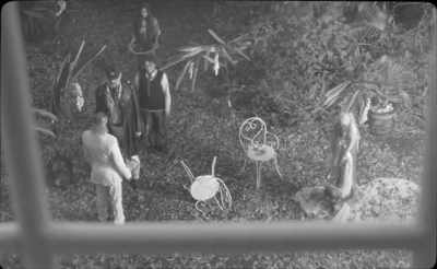 The Captain was accompanied
by a boy on a leash, - The Wild Boys