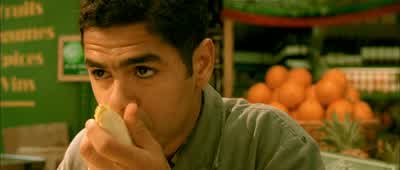The "cretin" is Lucien. He's no genius, but Amélie likes him. She likes the way he handles each endive like a precious objectto be treated with care. It's his wayof showing his love of good work. Look at him! - Amélie