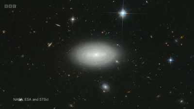 The debate revolved around some
mysterious objects in the sky, - Secrets of Size: Atoms to Supergalaxies