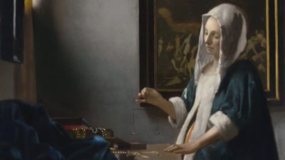 The delicate scales
in her right hand are level, - Vermeer: The Greatest Exhibition