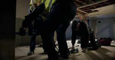 The gang's come prepared
with a heavy-duty hydraulic ram. - White Rabbit Project