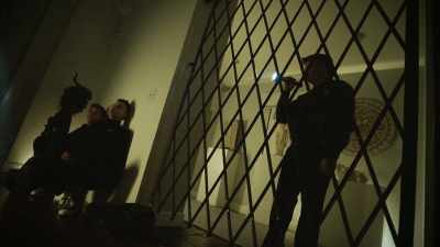 The guy flashes
his flashlight. - History's Greatest Heists with Pierce Brosnan