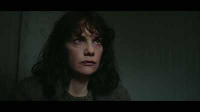 The husband is sitting in prison
awaiting trial. - The Woman in the Wall