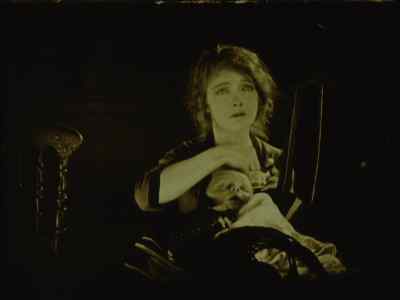 The little hands grow cold
upon her breast. - Way Down East