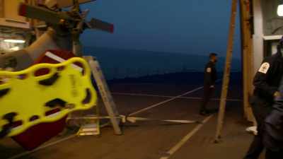 The medic is going out to offer
first aid to the man overboard. - Warship: Life at Sea