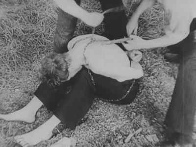 The Nazis also would tie a man
in chains in this manner, - Nazi Concentration Camps