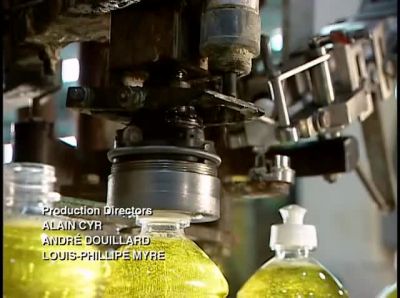 THE NEXT MACHINE APPLIES
A TWIST CAP WITH PULL-OUT SPOUT. - How It's Made