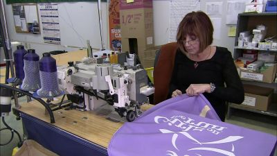 THE NEXT WORKER STITCHES
A SLEEVE ONTO THE FABRIC - How It's Made