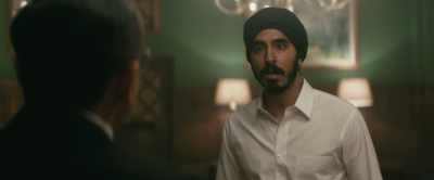 The oldest and wisest lady plays the drums. - Hotel Mumbai