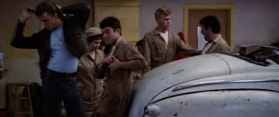 The problem's in this rubber band engineThe problem's in your mouthYeah and where you gonna get a new carburettor huhYou ever heard of borrowing Kenickie you got any Scotch tape - Grease
