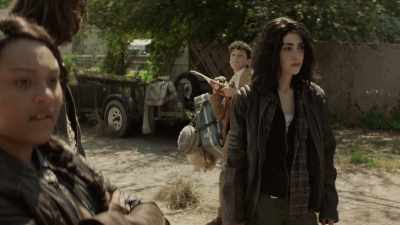 The smoke plume and
the firelight after dark - The Walking Dead: World Beyond