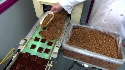 THE SQUARES MOVE ON
TO ANOTHER REFRIGERATED BELT - How It's Made