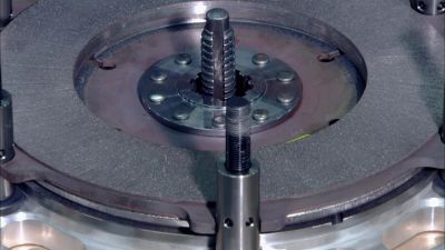 The technician places
a stand over each bolt, - How It's Made