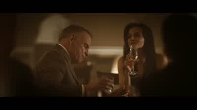 The woman sitting two tables behind you what's she wearingWith the red hair and the silk dress facing you YeahThat's not a woman - Hitman