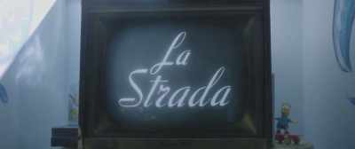 [theme music plays,
music box tinkling] - In Search of Fellini