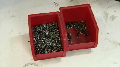 THEN HE ATTACHES
THE SECOND PART OF THE RIVETS - How It's Made