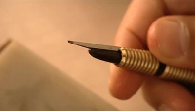 THEN HE SHARPENS ANOTHER TOOL
CALLED A LOZENGE GRAVER. - How It's Made