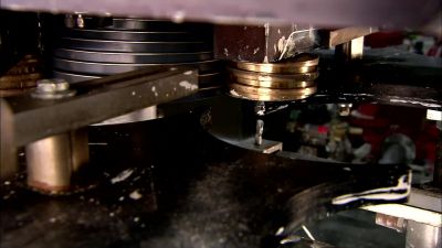 THEN IT'S ON TO
WHAT'S CALLED A LID PRESS. - How It's Made