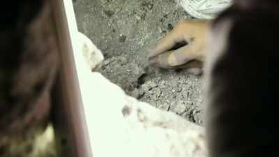 Then teasing through layers
of undisturbed dirt... - Lost Treasures of the Maya