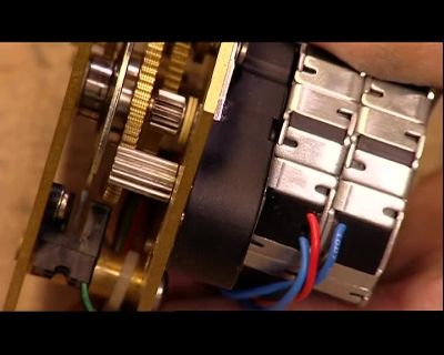 THEN THEY PLACE THE LABELS
ON A MINI-PRESS. - How It's Made