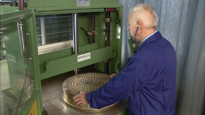 THEN, WITH A HYDRAULIC
PRESS AND PUNCH, - How It's Made