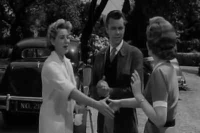 There you are.
There's your bag, Miss Young. - Cast a Dark Shadow