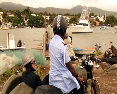 There she is, over there. - Death in Paradise