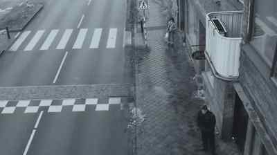There. She turns around
when she sees the officer. - The Bridge