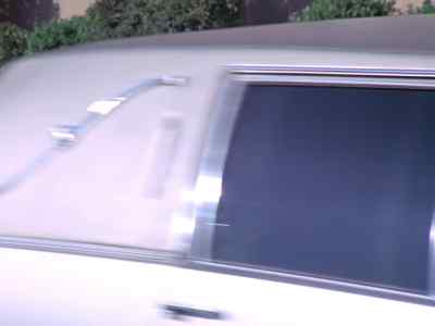 They are now in a gray sedan... - Wonder Woman
