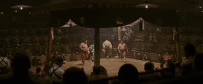 They are throwing salt to purify the ring. - Memoirs of a Geisha