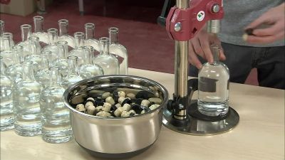 THEY CORK EACH BOTTLE
INDIVIDUALLY - How It's Made