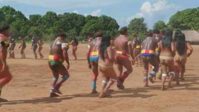 THEY DANCE TO CELEBRATE
A CHIEF, - Lost Cities of the Amazon