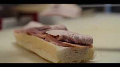 They hardly ever touch the sandwich.
Everything is done with a knife. - Street Food: USA