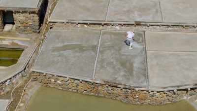 They painstakingly stir each salt pan - Europe From Above